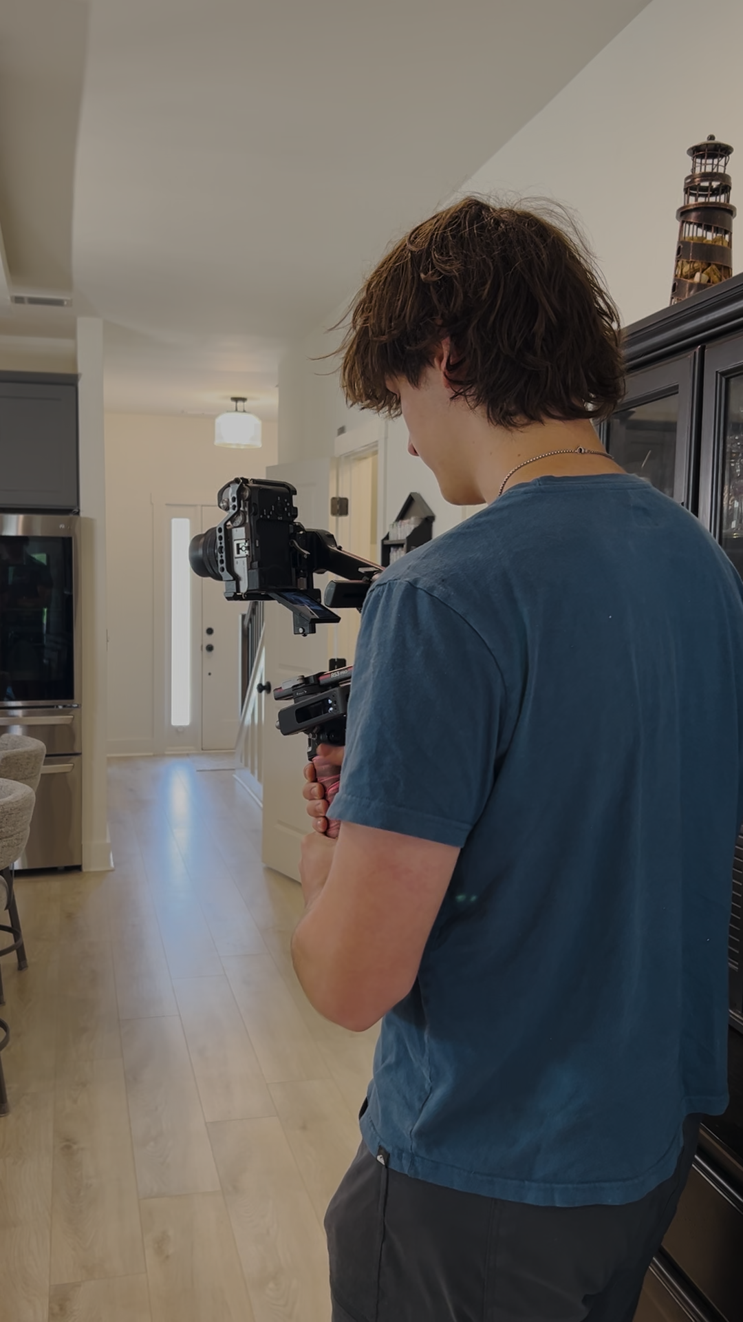 30foot Atlanta videographer operating a gimbal-mounted cinema camera on an onsite live production shoot